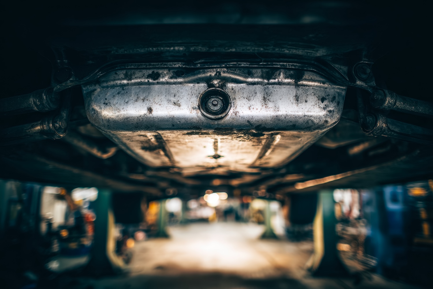 An oil sump pan under a car