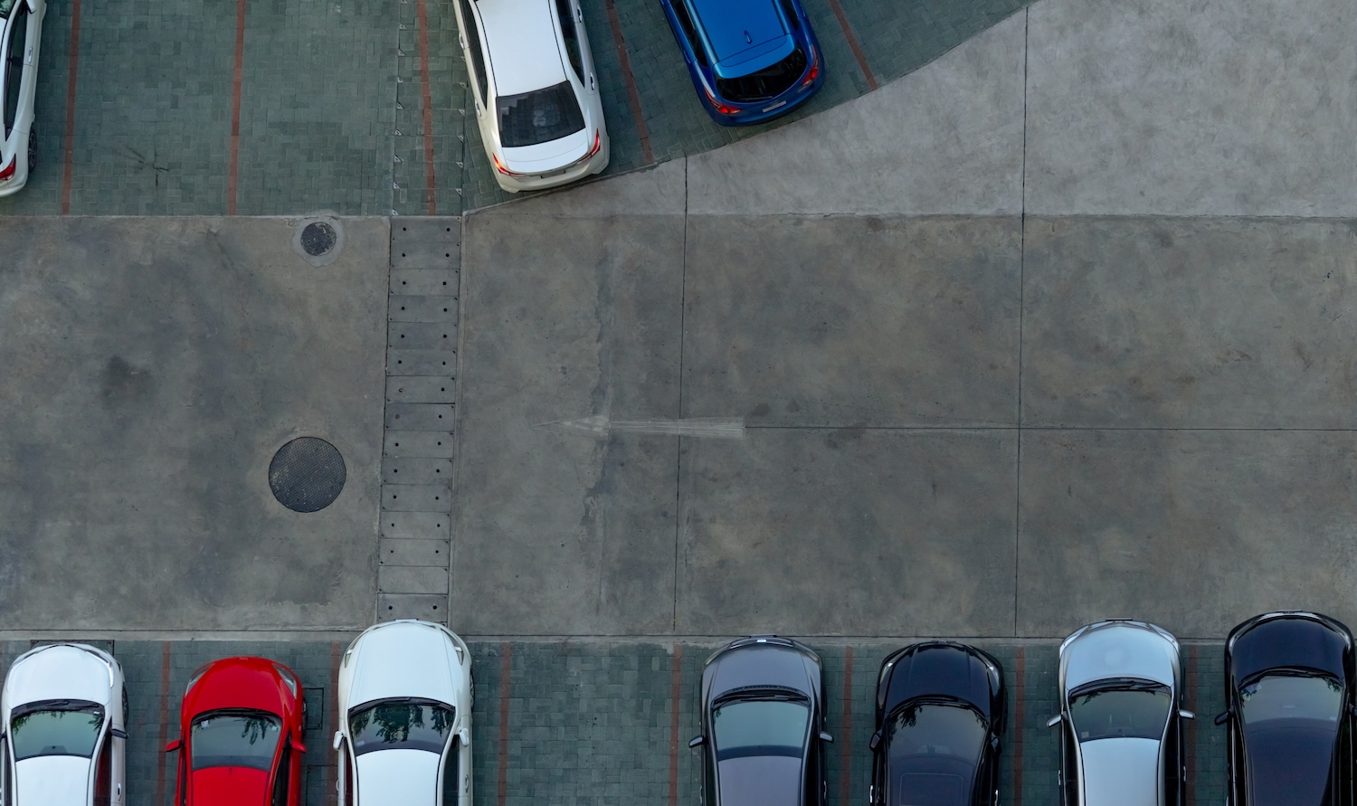 Top view of a car park showing the importance of parking radar sensor replacements