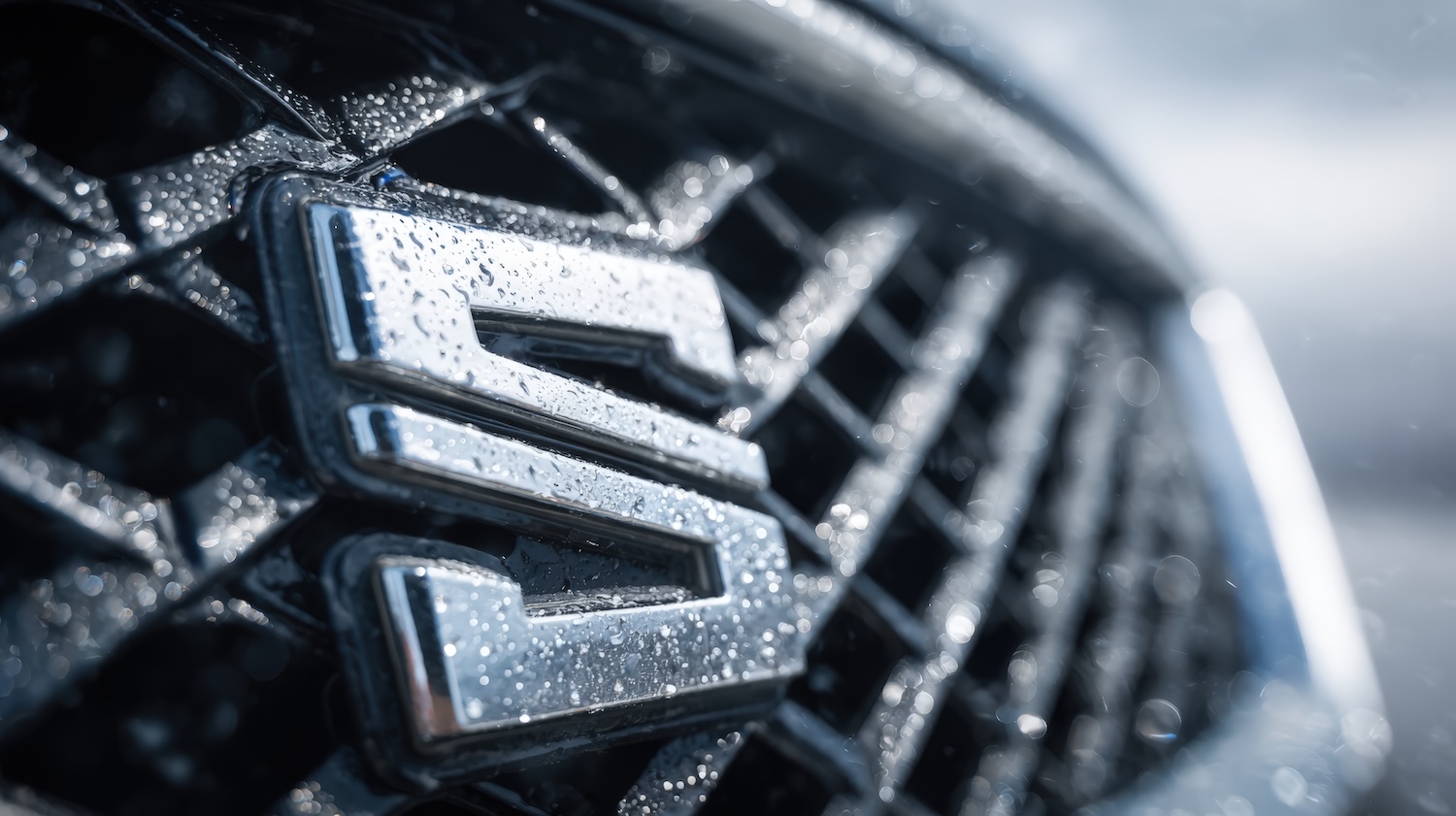 An automotive car badge on a car's front grille