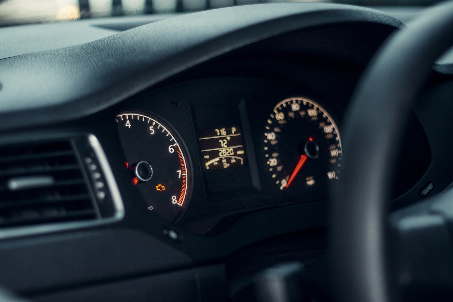 A dashboard instrument cluster for a car